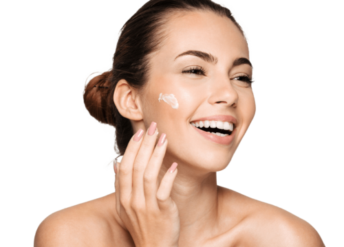 Photo of a woman applying skincare products to her face