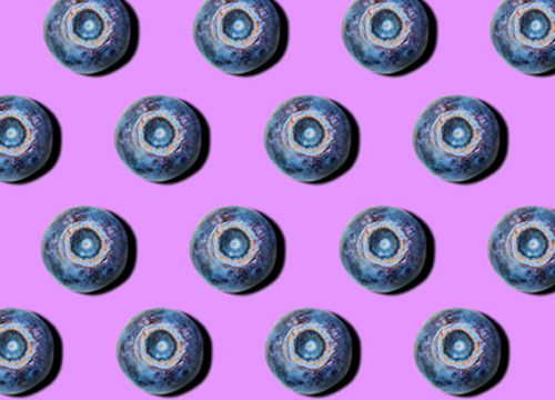 Blueberries on a purple background