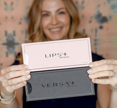 Photo of Melissa holding up a box of Revanesse Versa